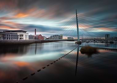 Sunrise and sweeping clouds at the River Tawe and the M ...