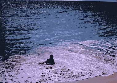 Abstract of a woman enjoying the waves in the ocean whi ...
