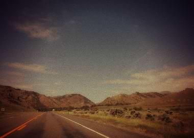 Open road driving through the mountains in Nevada.
