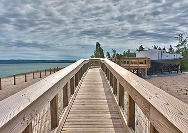 Freshly constructed, wooden boardwalk along a sandy bea ...