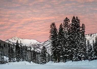 The sun lights the clouds and the snow on the Wasatch M ...