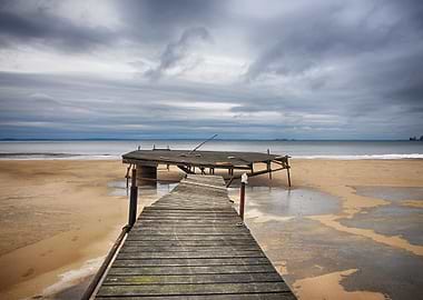 Old jetty on the beach a dramatic winter day.