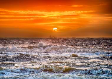 The crashing waves on the Dutch beach at sunset....