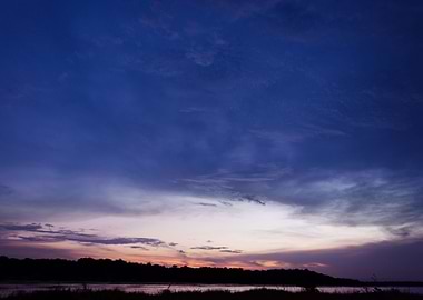 This is a stunning picture of the sun setting on the Ri ...