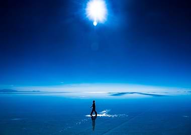 Man walking on water in Uyuni salt flats