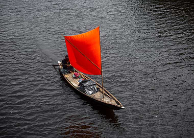 A Red color Sail Boat