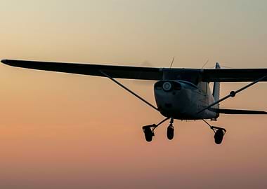 A plane in the golden sky.