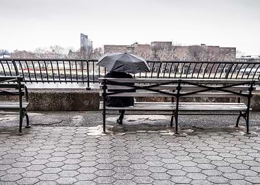 man umbrella bench city