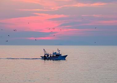 Boat at the sea with sunse