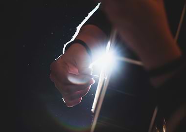 Musician plays guitar