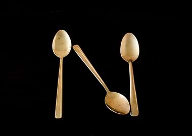 Letter N made of spoons