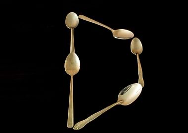 Letter D made of spoons