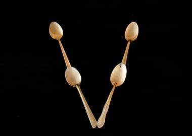 Letter V made of spoons