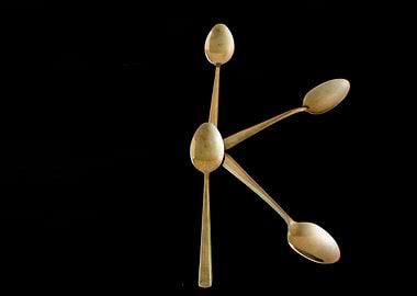 Letter K made of spoons