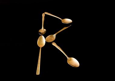 Letter R made of spoons