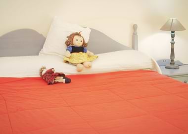 Doll bed red cover
