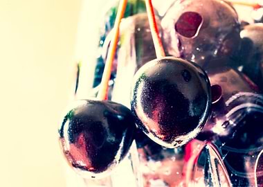 Two cherries in glass