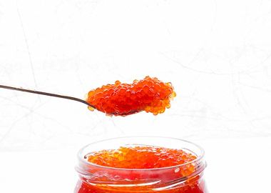 Spoon of red caviar