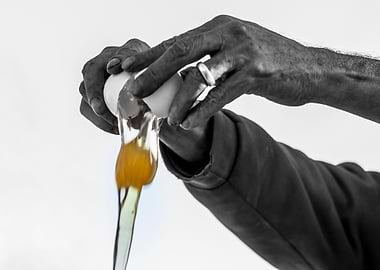 Hands man cracking an egg