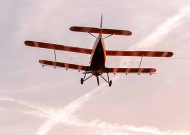 Plane flying in the sunset