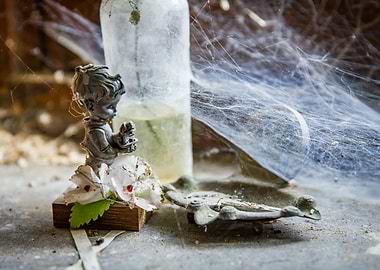 Old figurine with cobweb