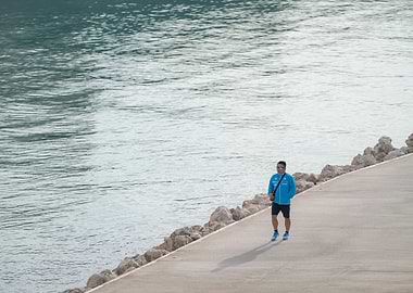 Man Walking Near Water