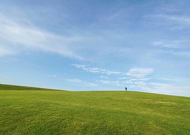 Man in Wide Green Grass