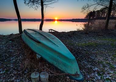 Boats On Lake Shore At Sun