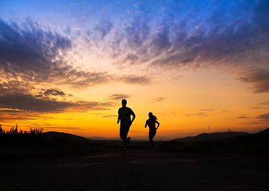 Silhouette Of Couple Runni