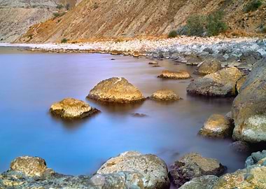Rocky Beach At Sunset Ligh