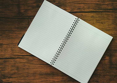 Notebook on brown wood