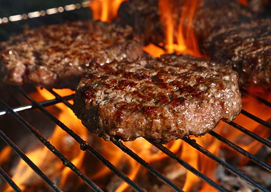 Burger at flame grill