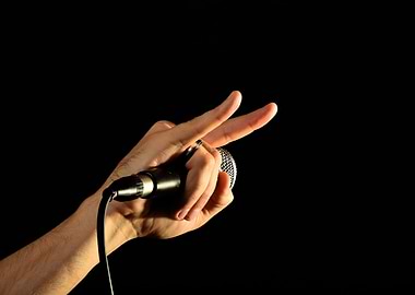 Devil horns and microphone