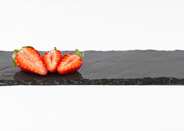 Three strawberries on slat