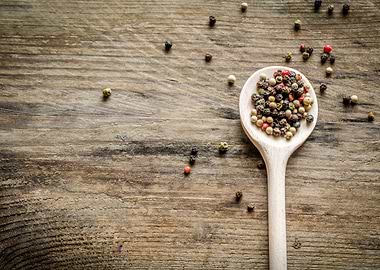 Wooden spoon with pepper