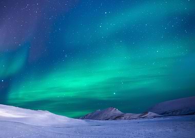 Aurora Behind Snowy Hills
