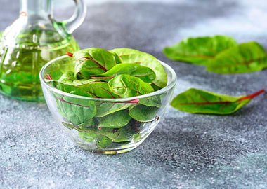 Glass bowl of red chard