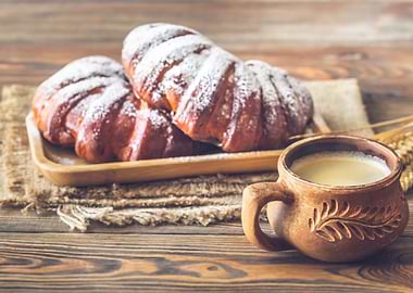 Buns with cup of coffee