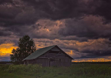 Barn Under Storm Clouds
