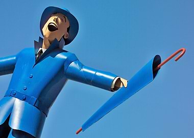 Blue man with umbrella