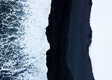 Black sand waves and snow