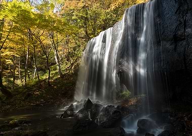 Waterfall under autumn sun