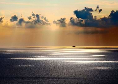 sun lights spot on sea