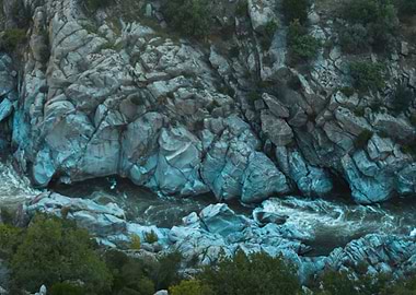 Blue rocks near a lake