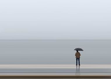 Man in rain with umbrella