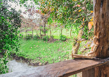 Wooden manikin sitting