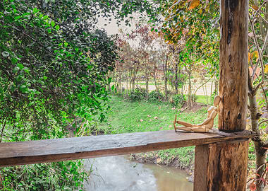 Wooden manikin sitting