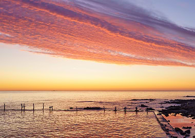 Old pier in red sunset