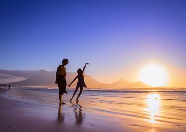 Women dancing on beach