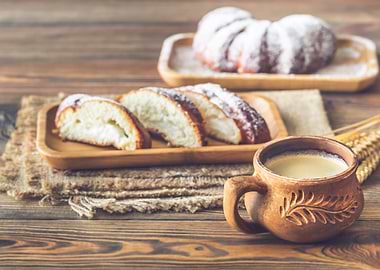 Two buns and cup of coffee